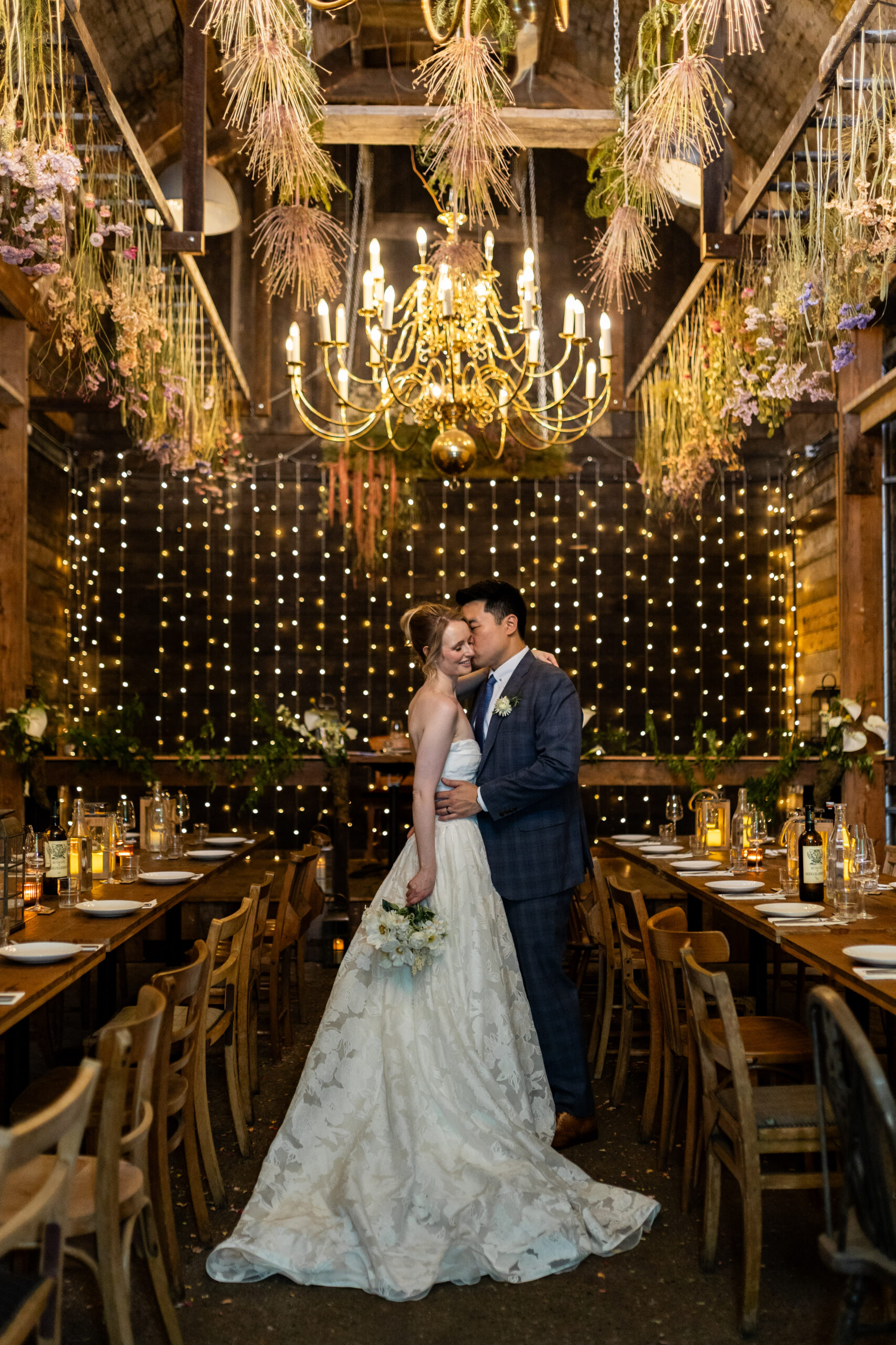 wedding couple posing at the Old Timber Store in Maltby Street Market.